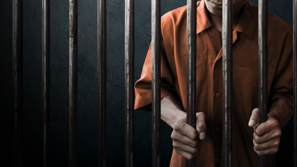 A prisoner behind bars