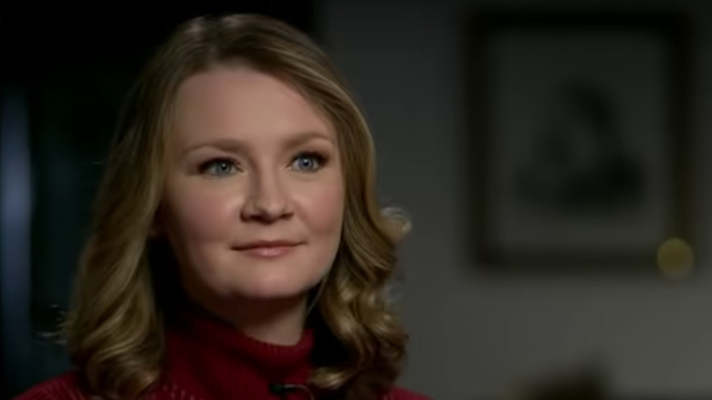 Anna Delvey Sorokin in red turtleneck