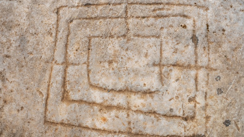 Morris board inscribed in construction material