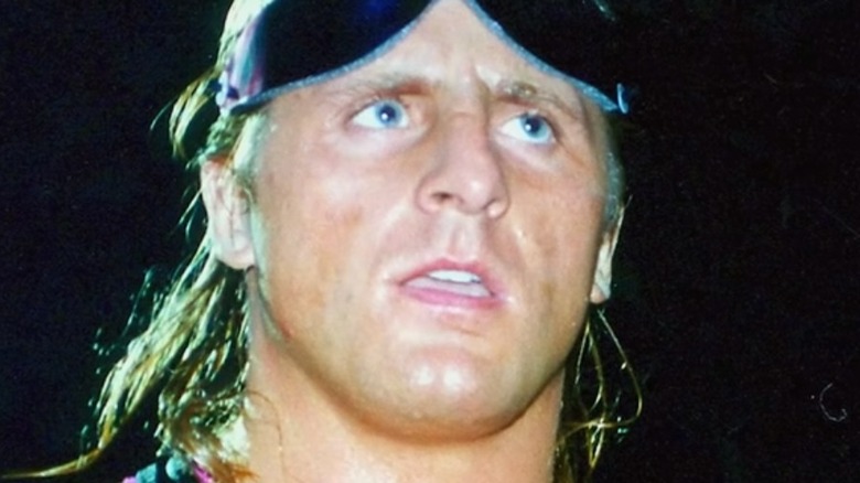 Bret Hart smiles in ring