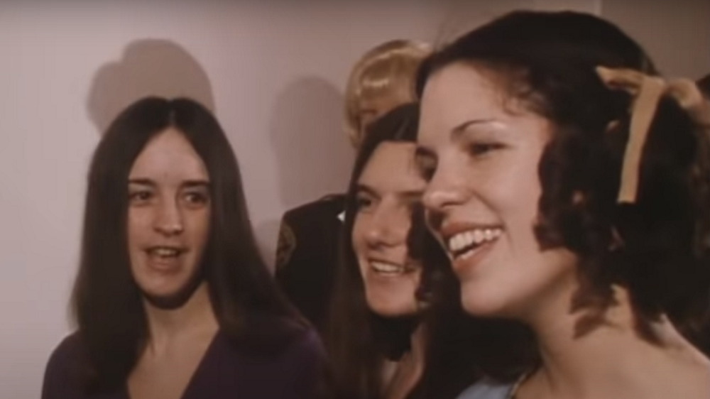 Susan Atkins, Patricia Krenwinkel, and Leslie Van Houten singinging