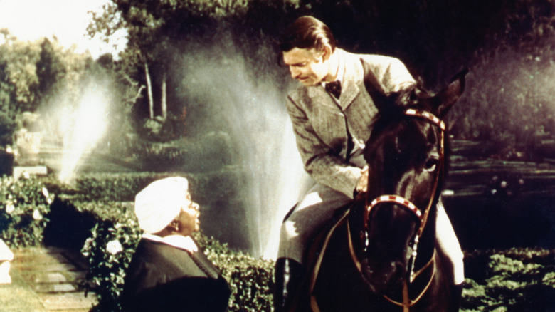Hattie McDaniel with Clark Gable on a horse in "Gone with the Wind."