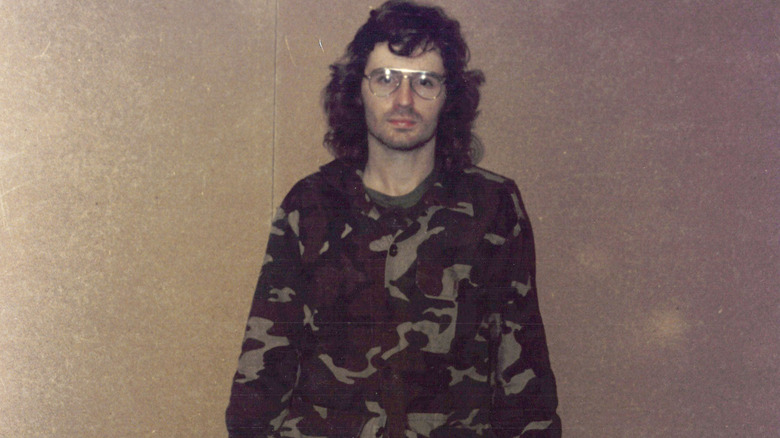 David Koresh standing in fatigues 