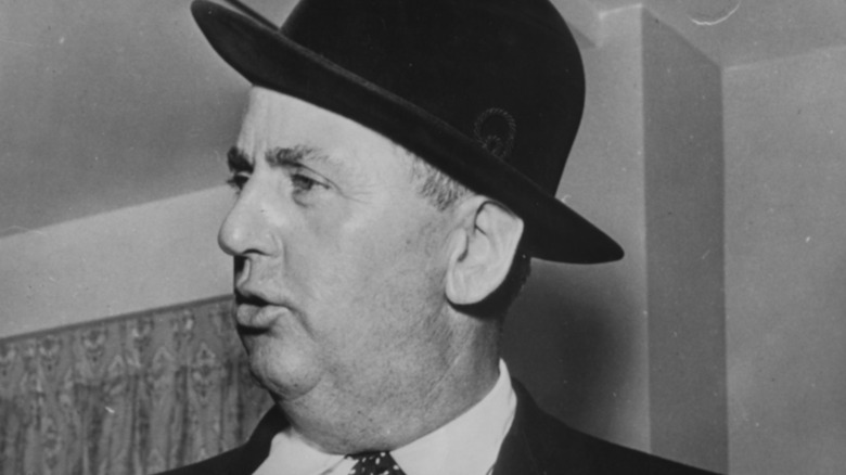 Colonel Parker wearing a hat