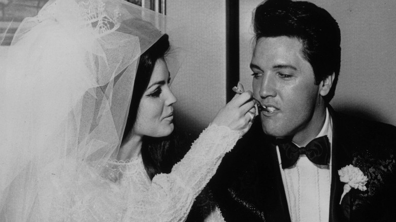 Elvis and Priscilla Presley at their wedding