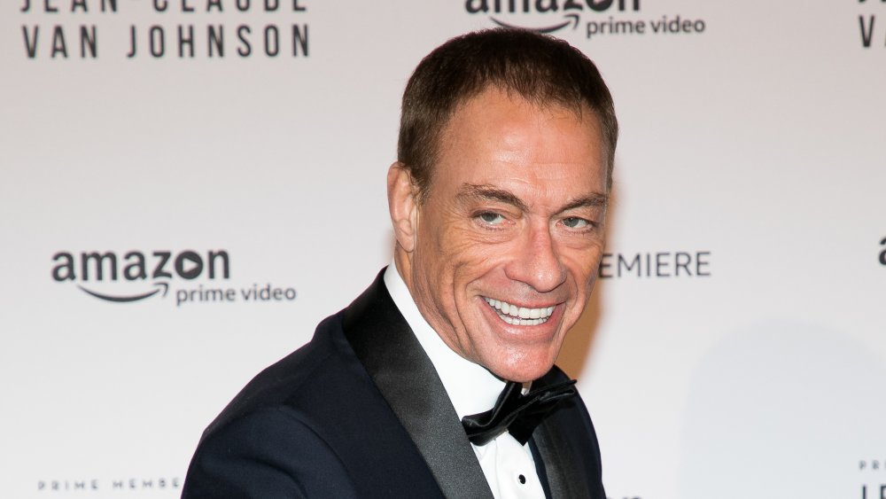 Jean Claude Van Damme posing in a suit