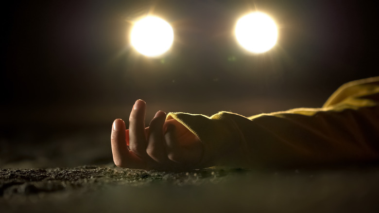 Body laying in street