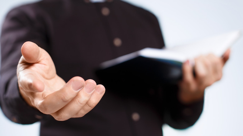 person holding bible