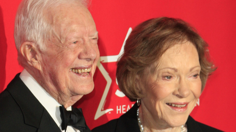 President Jimmy Carter embraces wife