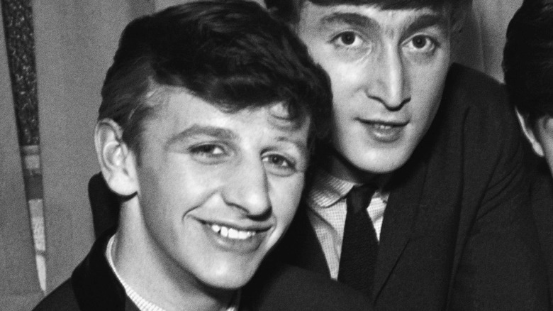 Ringo Starr and John Lennon smiling