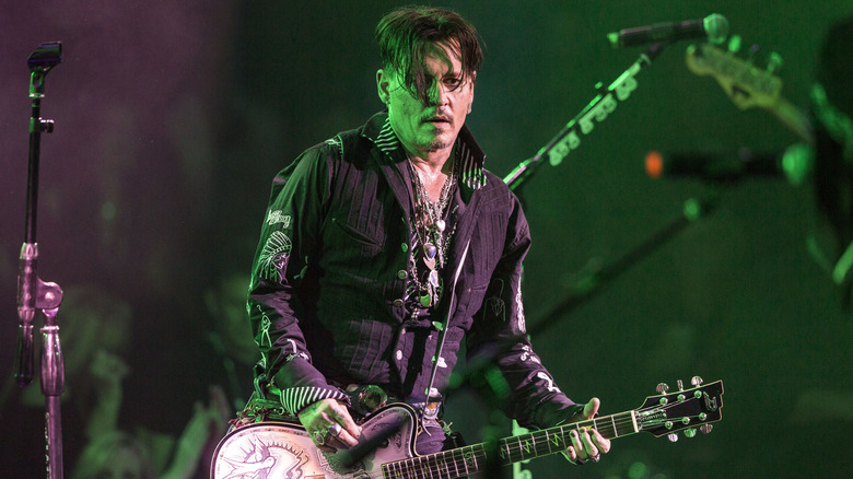 Johnny Depp playing guitar
