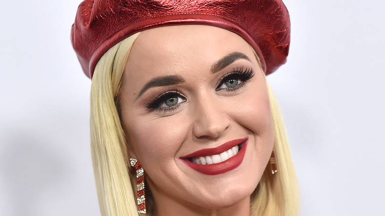 Katy Perry wears a red hat