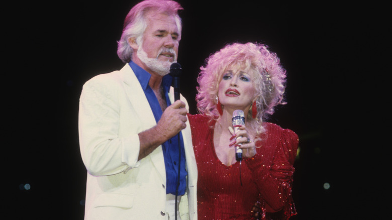 knny rogers and dolly parton performing on stage 1990