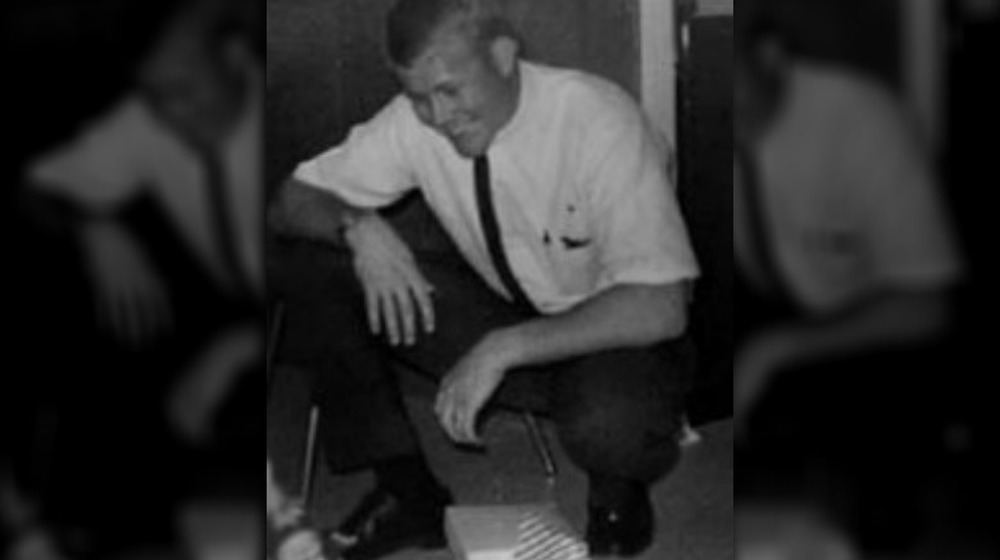 Charles Whitman crouching 