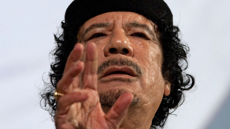 Muammar Gaddafi gesturing