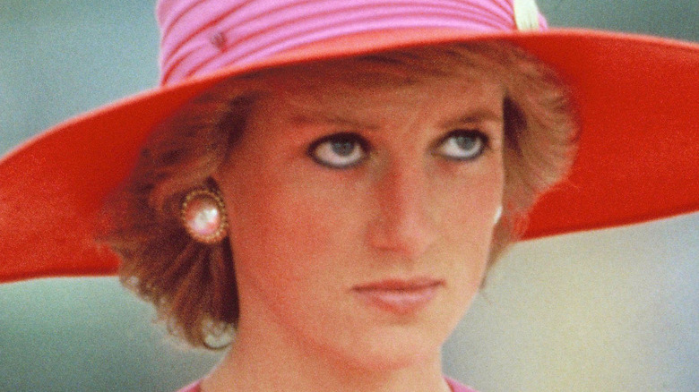 Princess Diana wearing red hat