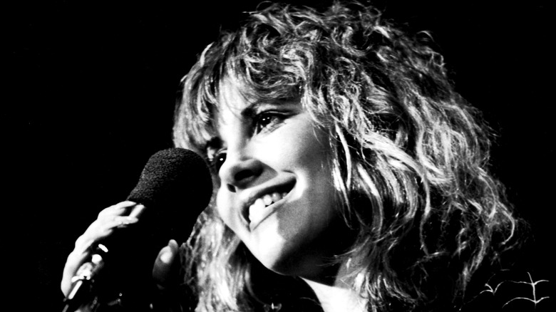 Steve Nicks smiling near microphone