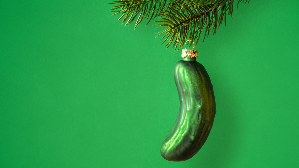 A rather obviously hidden Christmas pickle waits to be found