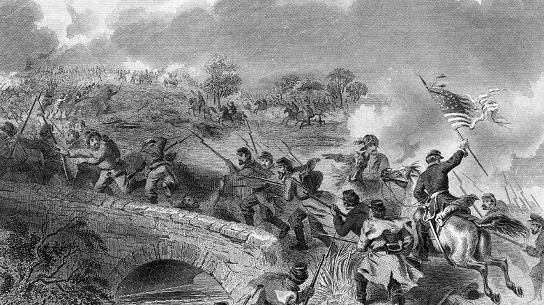 battle of antietam soldiers fighting and waving american flag