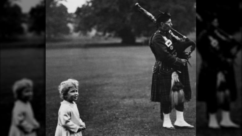 Young Queen Mother with piper