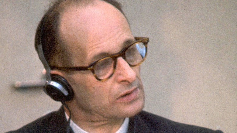 Adolf Eichmann in 1961 trial, wearing headphones