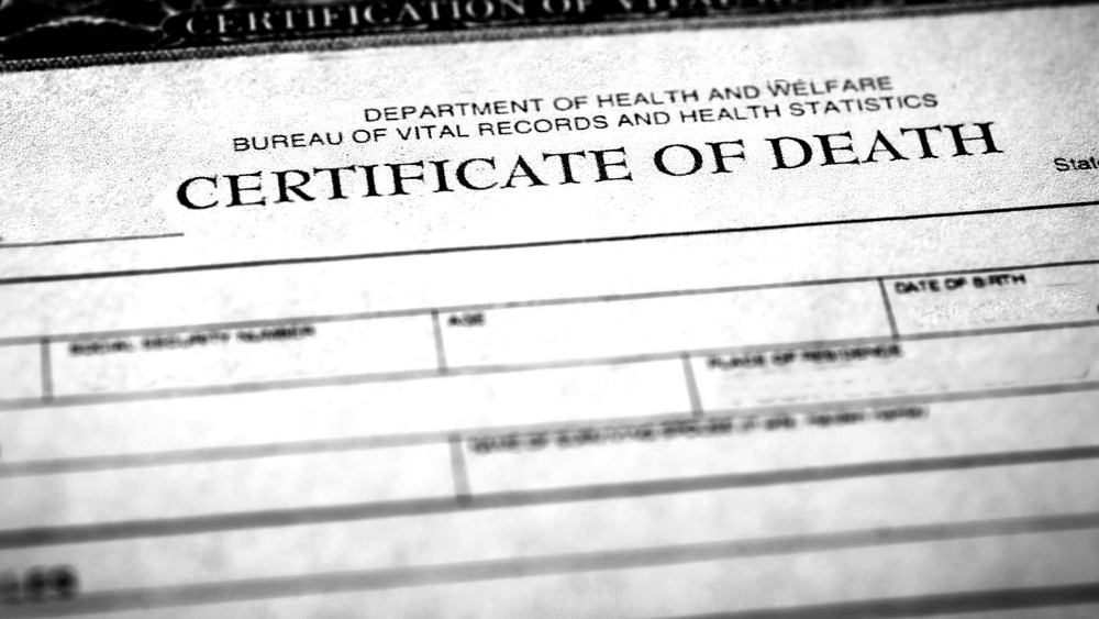 Death certificate and pen