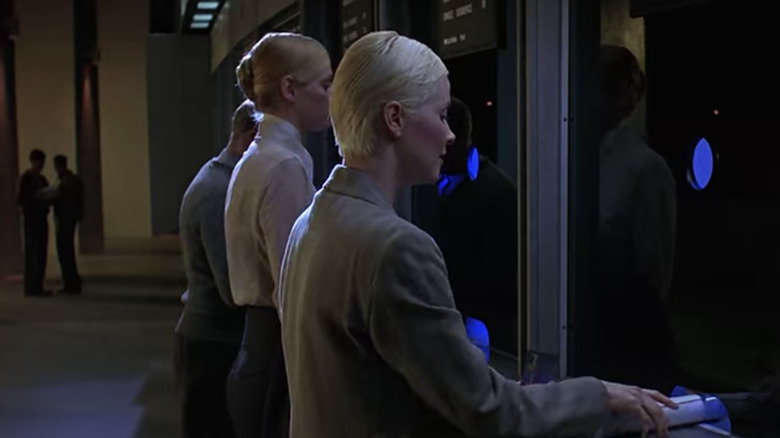 People ling up at kiosks for gene testing 