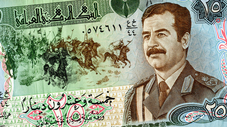 Iraq banknote featuring Saddam Hussein 