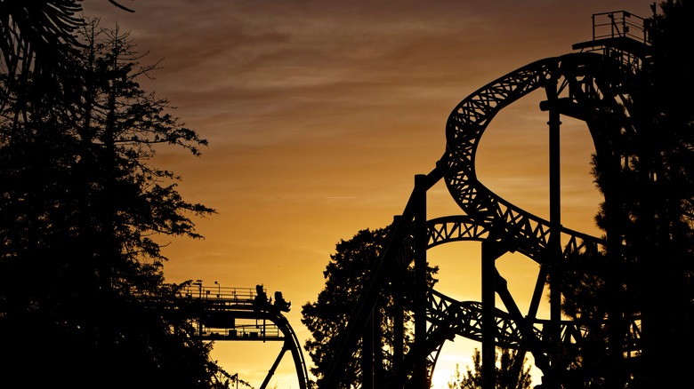 Roller coaster against sunset