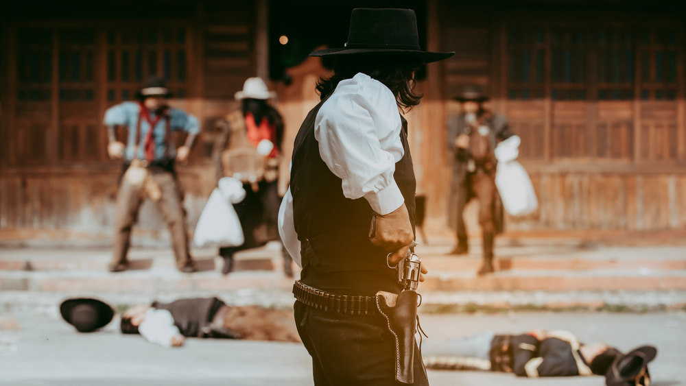 old west gunslinger with hand on gun