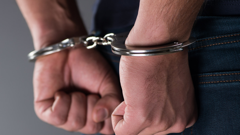 Hands handcuffed 