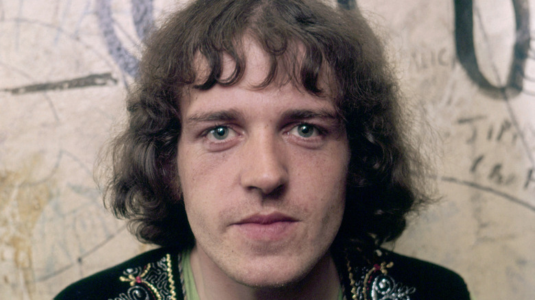Young Joe Cocker looking up and smiling