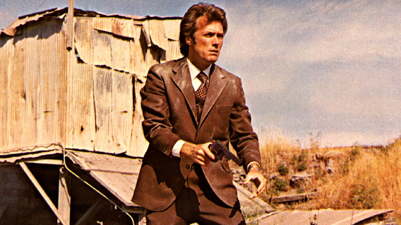 Clint Eastwood holding a gun as Dirty Harry