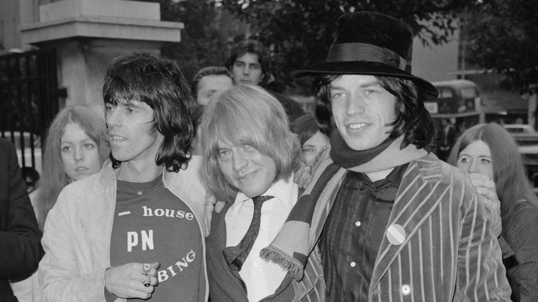 Black and white photo of Keith Richards, Brian Jones, and Mick Jagger