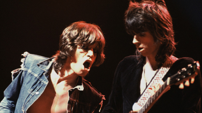 Mick Jagger performing onstage with Keith Richards