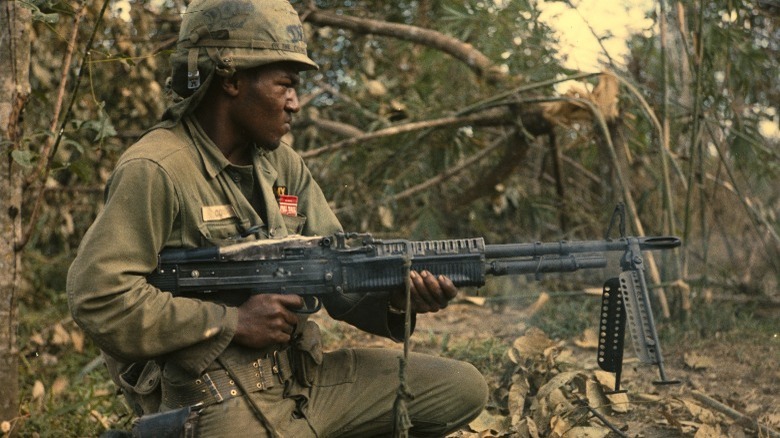 Soldier firing machine gun