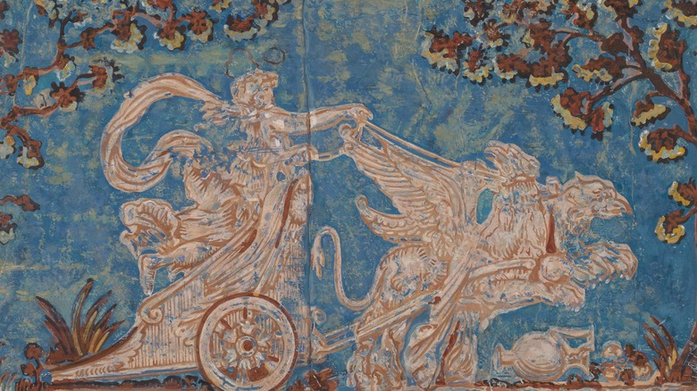 carving of a chariot race