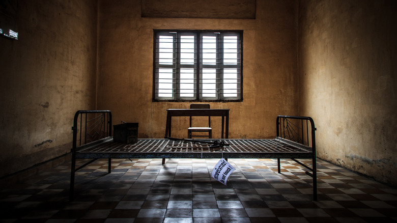 Prison cell bed frame tiled floor