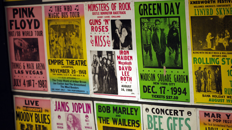 An array of vintage posters on wall for sale