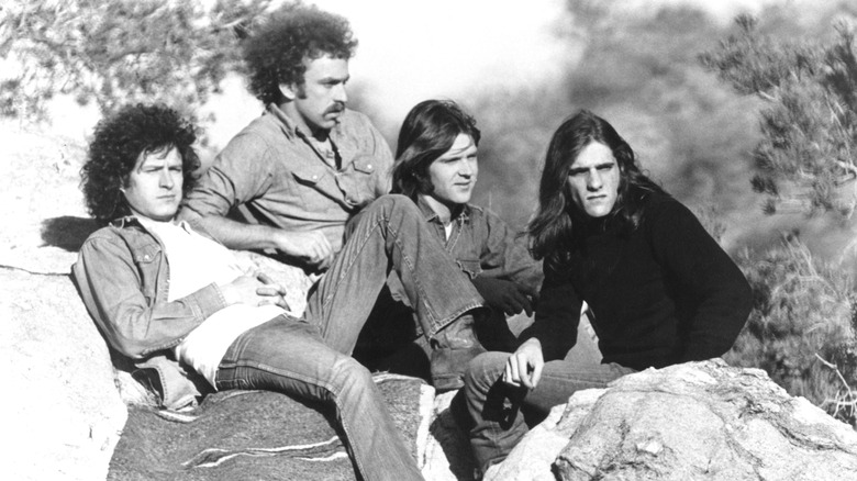 The Eagles in the early 1970s sitting on some boulders
