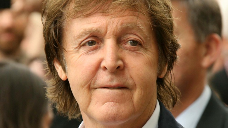 Paul McCartney biting lower lip