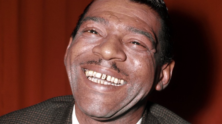 Little Walter plays the harmonica