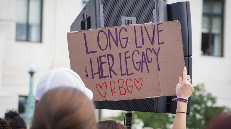 woman holding RBG sign