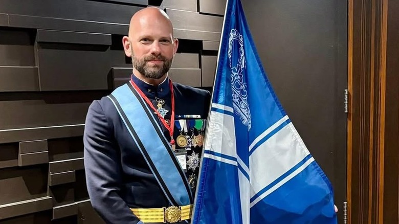 Grand Duke Travis McHenry holding the Westarctica flag