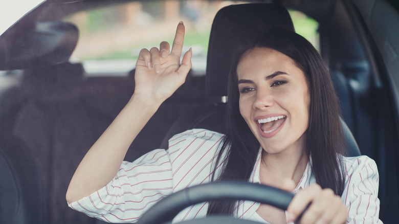 woman singing in car