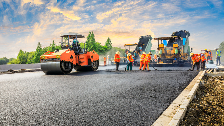 construction workers paving gravel