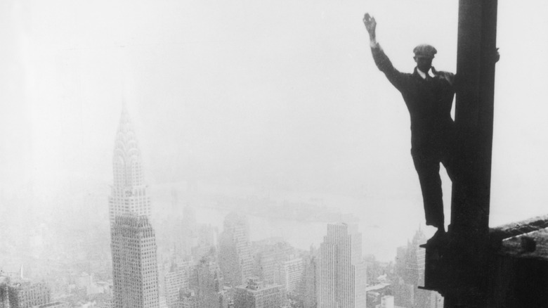 Worker balances on Empire State Building girder, 1931