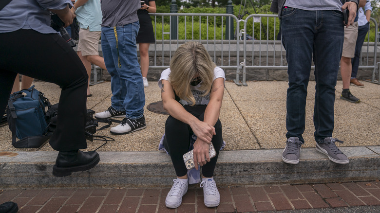 An activist reacts to the Dobbs ruling