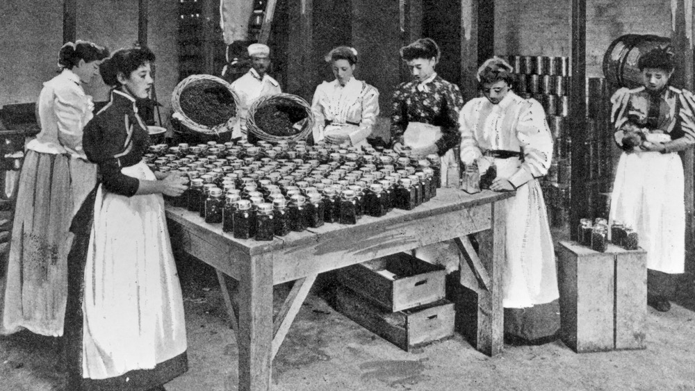Factory workers bottling product
