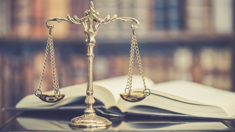 justice scales on legal book